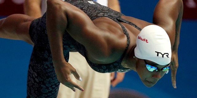 FILE - In this July 27, 2019, file photo, United States' Simone Manuel starts a heat of the women's 50-meter fresstyle at the World Swimming Championships in Gwangju, South Korea. Manuel joined with fellow Olympians Sue Bird, Chloe Kim and Alex Morgan to launch TOGETHXR, a media and commerce company aimed at girls and women. It will create content for social media platforms like Instagram and TikTok as well as its own YouTube channel. Billie Jean King cheered its announcement this week. "I can’t wait to share everything we have in store," Manuel tweeted earlier this week. " (AP Photo/Mark Schiefelbein, File)
