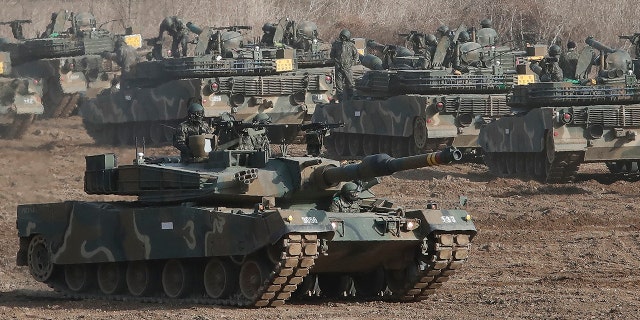 A South Korean Army K1A2 tank moves during a military exercise with US forces.