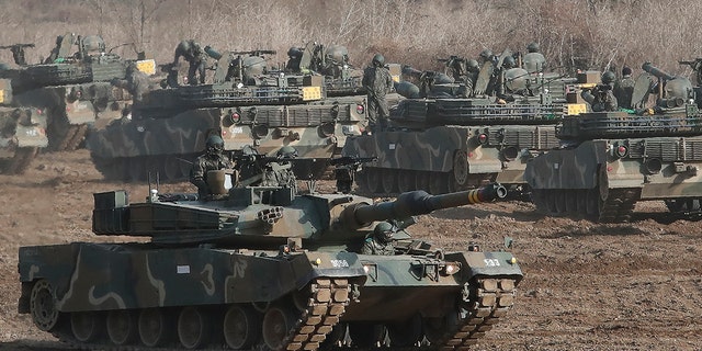A South Korean army's K1A2 tank moves during a military exercise in Paju, South Korea, near the border with North Korea, Wednesday, March 17, 2021. 