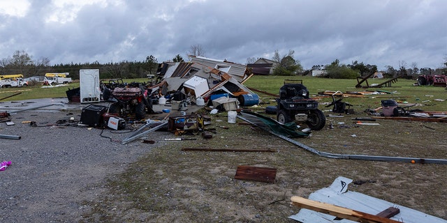 Debris litters weather-damaged properties at the intersection of County Road 24 and 37 in Clanton, Ala., the morning following a large outbreak of severe storms across the southeast, Thursday, March 18, 2021.