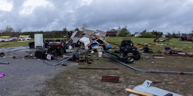 Debris litters weather-damaged properties at the intersection of County Road 24 and 37 in Clanton, Ala., the morning following a large outbreak of severe storms across the southeast, Thursday, March 18, 2021.