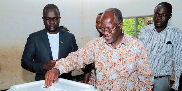 FILE - In this Sunday, Oct. 25, 2015 file photo, Tanzania's ruling party presidential candidate John Magufuli casts his vote in his home town of Chato, northern Tanzania.  (AP Photo, File)