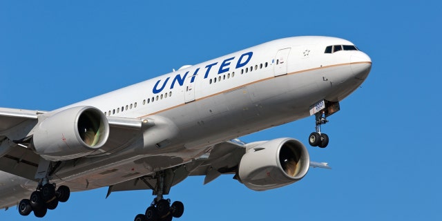 United Airlines passenger plane - Boeing 777 - arriving at Chicago O'Hare International Airport.