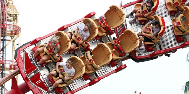 The California Amusement Park Association is requiring its members to modify seating on rides in order to "mitigate the effect of shouting." Parks in other parts of the country, such as Universal Studios Orlando, are already enforcing physical-distancing requirements between groups or parties on rides. (Gregg Newton/AFP via Getty Images)