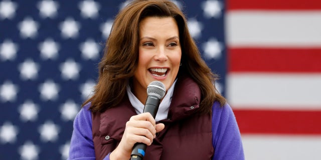 US-VOTE-HARRIS Michigan Governor Gretchen Whitmer talks with people as Democratic vice presidential nominee Senator Kamala Harris (D-CA) takes part in a campaign stop at IBEW Local 58 on October 25, 2020 in Detroit, Michigan. (Photo by JEFF KOWALSKY / AFP) (Photo by JEFF KOWALSKY/AFP via Getty Images)