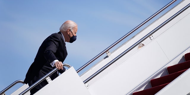 President Joe Biden recovers after stumbling while boarding Air Force One at Joint Base Andrews in Maryland on March 19, 2021. (AP Photo/Patrick Semansky)