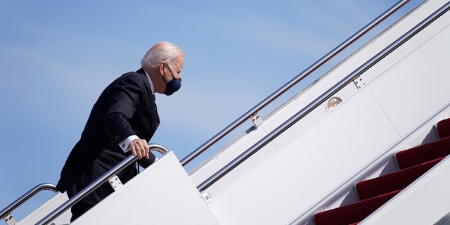 President Joe Biden recovers after stumbling while boarding Air Force One at Joint Base Andrews in Maryland on March 19, 2021. (AP Photo/Patrick Semansky)