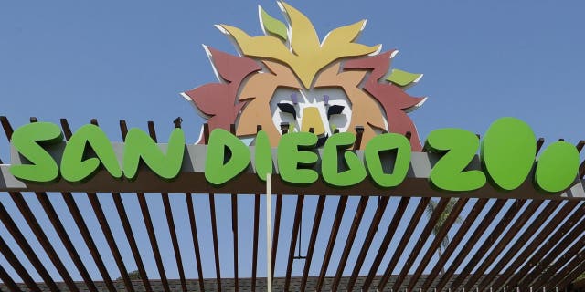 FILE - In this June 11, 2020, file photo, a sign is near the entrance to the San Diego Zoo in San Diego. (AP Photo/Gregory Bull, File)