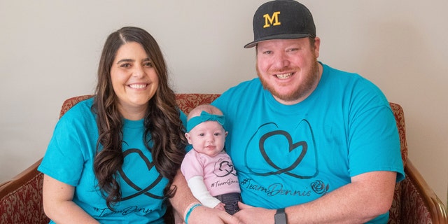 March 17, 2021: Jackie Dennis, left, and her husband, Ricky Dennis, pose for a photo with their daughter, Mia Rose, at Henry Ford Health System in Detroit.