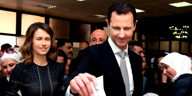 In a statement, Assad’s office said the first couple did PCR tests after they felt minor symptoms consistent with the COVID-19 illness. (Syrian Presidency via AP, File)