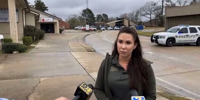 Casey Rayborn Hicks, public information officer for the East Baton Rouge Sheriff's Office, briefs the media at the scene of an attempted murder-suicide in Baton Rouge Tuesday. 