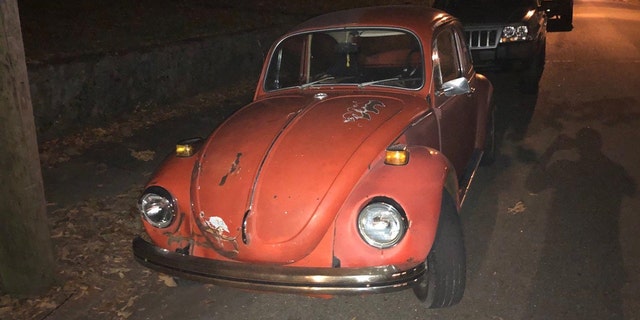 Daphne and John Westbrook may be traveling in this orange 1971 Volkswagen Beetle. 