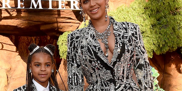 FILE - Beyonce, right, and her daughter Blue Ivy Carter arrive at the World Premiere of "The Lion King" in Los Angeles on July 9, 2019. Blue Ivy's name was added to the nominees list for Best Music Video of Her Mother "Girl with brown skin." (Photo by Chris Pizzello / Invision / AP, file)