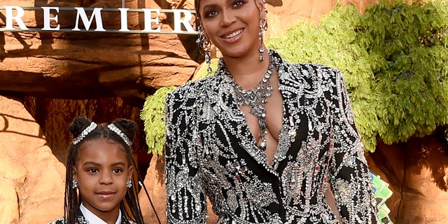 FILE - Beyonce, right, and her daughter Blue Ivy Carter arrive at the world premiere of "The Lion King" in Los Angeles on July 9, 2019. Blue Ivy's name was added to the nominee list for best music video for her mother's "Brown Skin Girl." (Photo by Chris Pizzello/Invision/AP, File)