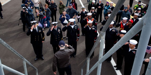 Vice President Joe Biden salutes as he leaves the USS Gettysburg after welcoming home sailors at Mayport Naval Base, Fla, Dec. 8, 2011. (Official White House Photo by David Lienemann)