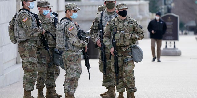 National Guard keep watch on the Capitol, Thursday, March 4, 2021, on Capitol Hill in Washington. Capitol Police say they have uncovered intelligence of a "possible plot" by a militia group to breach the U.S. Capitol on Thursday, nearly two months after a mob of supporters of then-President Donald Trump stormed the iconic building to try to stop Congress from certifying now-President Joe Biden's victory. (AP Photo/Jacquelyn Martin)