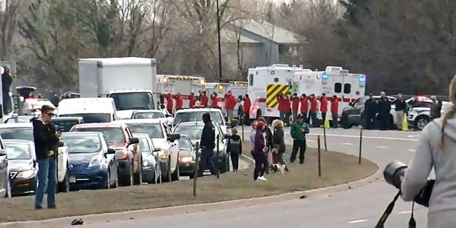 Vehicles line up Wednesday to watch the police procession of fallen Boulder Police Officer Eric Talley's body.