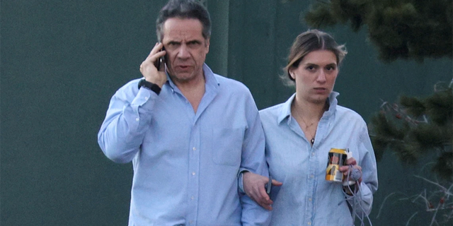 Governor Andrew Cuomo, walks with his daughter Mariah Kennedy-Cuomo on the grounds of the Governor's House on March 12, 2021. Cuomo's campaign is said to have helped increase sales of the Governor's Book by sending at least one note to his list broadcast.  signed on behalf of Cuomo's children. 