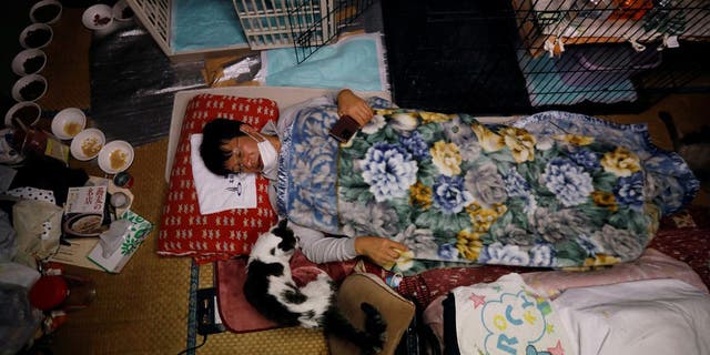 Kato, 57, has been taking care of dozens of cats in Fukushima for the last decade. (Reuters)