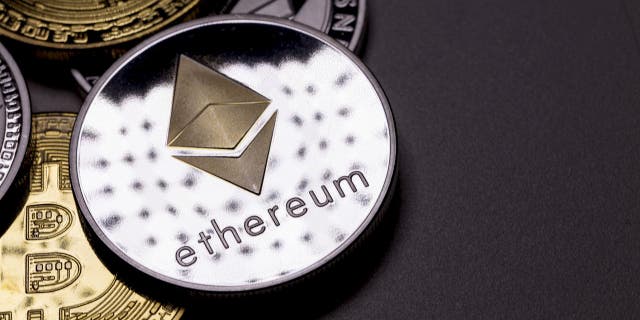 izmir, Turkey - January 12, 2018 Close up ethereum coin with other crypto coins shot in black background in studio (iStock)