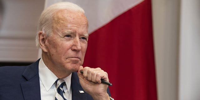 President Biden listens while meeting virtually with Andres Manuel Lopez Obrador, Mexico's president, in the Roosevelt Room of the White House in Washington, D.C., March 1, 2021.  