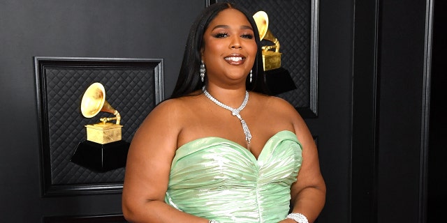 Lizzo is pictured at the 63rd Annual GRAMMY Awards in March. The singer recently tried the TikTok trend of eating mustard on watermelon but seemed confused by the pairing. (Photo by Kevin Mazur/Getty Images for The Recording Academy )