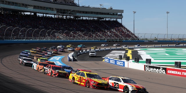 AVONDALE, ARIZONA - MARCH 14: Bubba Wallace, driver of the #23 McDonalds Toyota, and Joey Logano, driver of the #22 Shell Pennzoil Ford, Lead the field during the NASCAR Cup Series Instacart 500 at Phoenix Raceway on March 14, 2021 in Avondale, Arizona. (Photo by Christian Petersen/Getty Images)