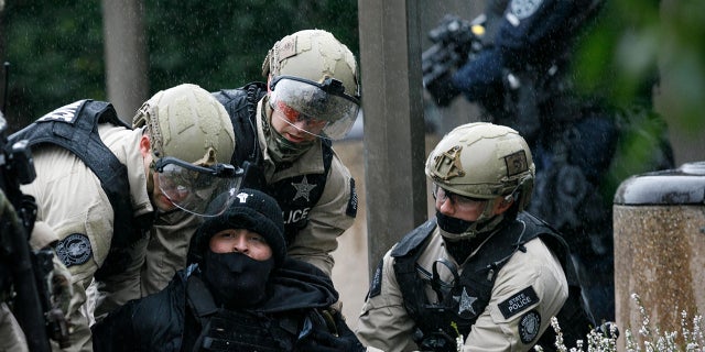 Police made multiple "targeted arrests" in Salem on Sunday.