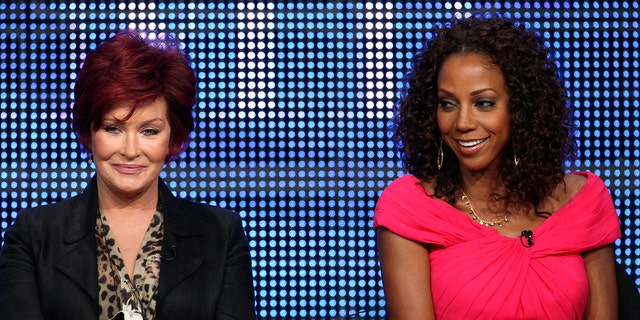 Holly Robinson Peete (R) claims Sharon Osbourne (L) called her 'ghetto' and helped get her fired. 
