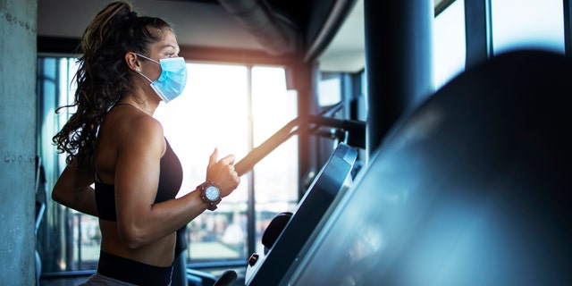 Early research suggests that face masks used to prevent the spread of the novel coronavirus are safe to use even during intense exercise, and could help to curb the spread of COVID-19 at indoor gyms. 