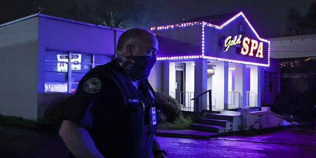 City of Atlanta Police Officer Davis works at the scene outside of Gold Spa after deadly shootings at a massage parlor and two day spas in the Atlanta area, in Atlanta, Georgia, U.S. March 16, 2021. (REUTERS/Chris Aluka Berry)