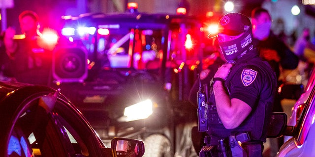 Miami Beach Police arrive on the scene to disperse a crowd that formed near Seventh Street and Alton Road, after spring break crowds were sent away from Ocean Drive in Miami Beach, Fla., on Sunday, March 21, 2021. In nearby Miami, two tourist were robbed at gunpoint early Monday. 