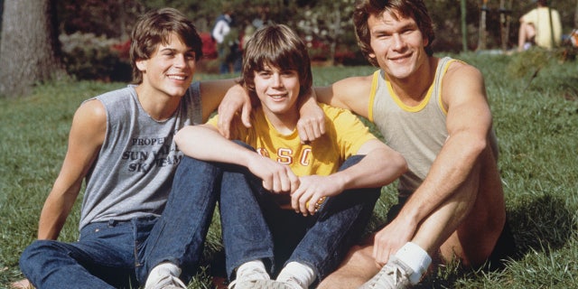 Left to right: Rob Lowe, C. Thomas Howell and Patrick Swayze on the set of 'The Outsiders.' (Photo by Nancy Moran/Sygma via Getty Images)