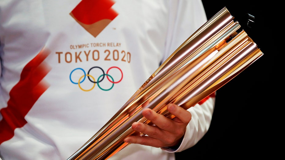 Woman arrested for trying to douse Olympic torch