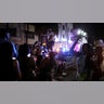 A man dances on top of a police car as revelers enjoy spring break festivities despite an 8 p.m. curfew imposed by local authorities, amid the coronavirus pandemic, in Miami Beach, Florida,? March 20, 2021. REUTERS/Marco Bello