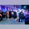 City of Miami Beach police officers arrest several males on Ocean Drive and 10th Street as spring break has officially begun Saturday, Feb. 20, 2021, in Miami Beach, Florida. Miami Beach officials are imposing an emergency 8 p.m.-6 a.m. curfew effective immediately, saying large, out-of-control spring break crowds crammed the beaches, trashed some restaurant properties and brawled in the streets. Tourists and hotel guests are being told to stay indoors during the curfew hours. (Pedro Portal/Miami Herald via AP)