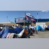 A Joe Biden campaign flag is seen at a migrants camp, where asylum seekers wait for U.S. authorities to allow them to start their migration process outside the El Chaparral crossing port in Tijuana, Baja California state, Mexico, on March 21, 2021. President Biden's pledge of a more humane approach has sparked a new rush to the border, threatening to become a huge political liability. Republicans are accusing him of opening the country's doors to illegal border crossers and sparking a "crisis" on the U.S.-Mexico frontier, while migrants out of Migrant Protection Protocols (MPP) program are stranded along the U.S.-Mexico border without knowing when or how they will be able to start their migratory process with U.S. authorities.