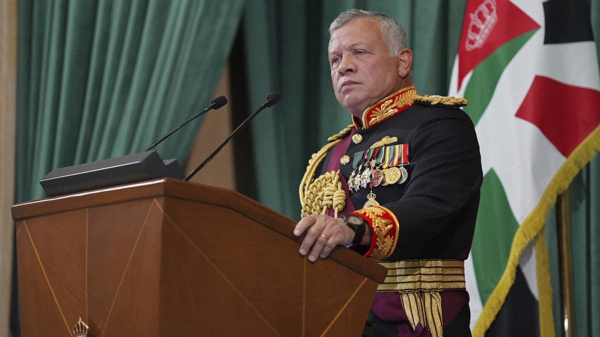 FILE - In this Dec. 10, 2020 photo released by the Royal Hashemite Court, Jordan's King Abdullah II gives a speech during the inauguration of the 19th Parliament's non-ordinary session, in Amman Jordan. Jordan’s army chief of staff says the half-brother of King Abdullah II was asked to "stop some movements and activities that are being used to target Jordan’s security and stability." The army chief of staff denied reports Saturday, April 3, 2021, that Prince Hamzah was arrested. He said an investigation is still ongoing and its results will be made public "in a transparent and clear form." (Yousef Allan/The Royal Hashemite Court via AP, File)