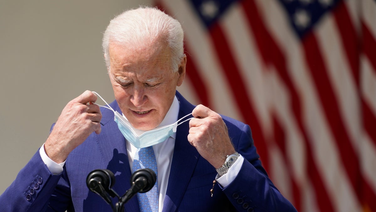 President Joe Biden removes his face mask to speak about gun violence prevention in the Rose Garden at the White House, Thursday, April 8, 2021, in Washington. (AP Photo/Andrew Harnik)