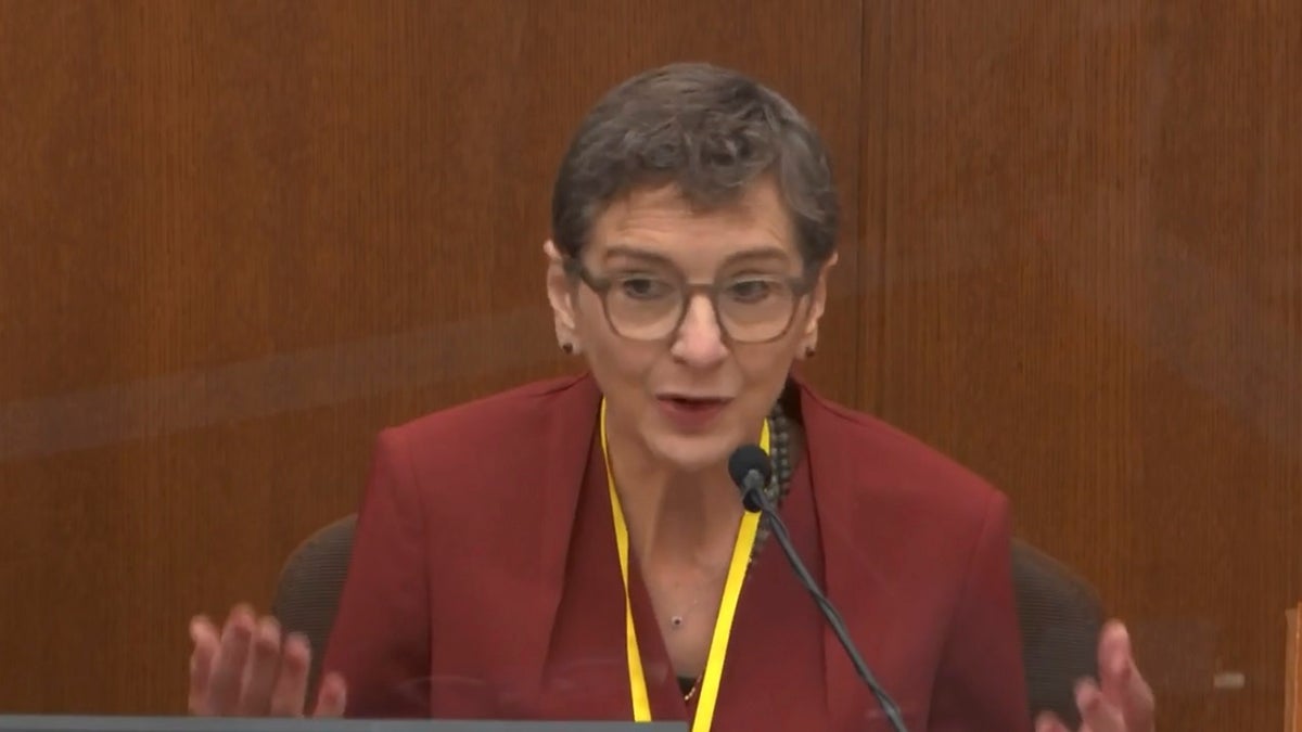 In this image from video, Dr. Lindsey Thomas, a forensic pathologist, now retired, testifies as Hennepin County Judge Peter Cahill presides, Friday, April 9, 2021, in the trial of former Minneapolis police Officer Derek Chauvin at the Hennepin County Courthouse in Minneapolis, Minn. (Court TV via AP, Pool)