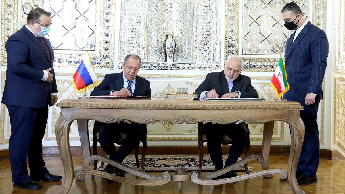  Iranian Foreign Minister Mohammad Javad Zarif center right, and his Russian counterpart Sergey Lavrov sign documents