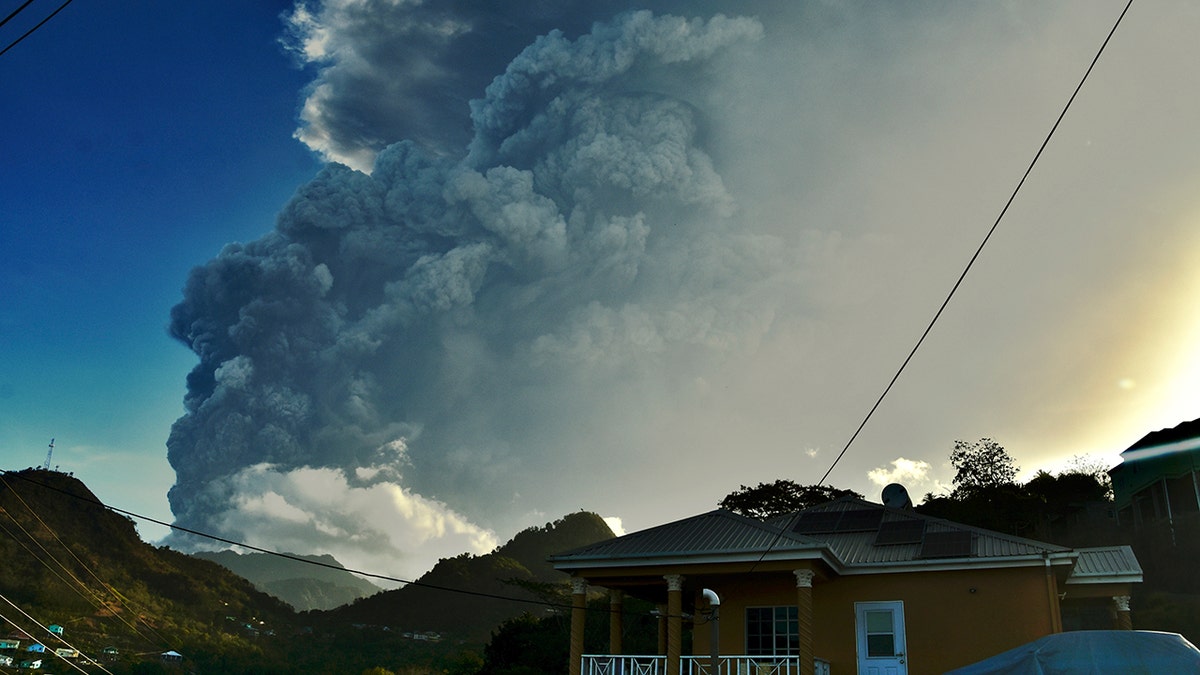 Ash rises into the air as La Soufriere volcano erupts on the eastern Caribbean island of St. Vincent, Tuesday, April 13, 2021. (AP Photo/Orvil Samuel)
