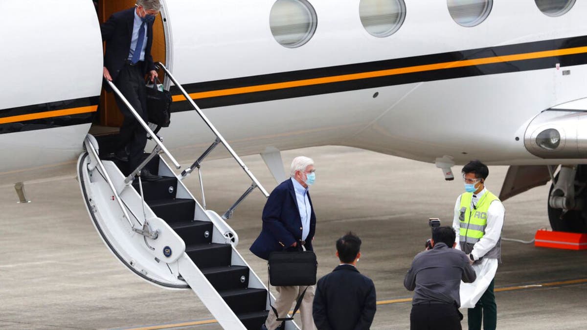 Former U.S. senator Chris Dodd, is followed by former U.S. Deputy Secretary of State James Steinberg as they disembark upon arrival in Taipei, Taiwan on Wednesday, April 14, 2021. (Pool Photo via AP)