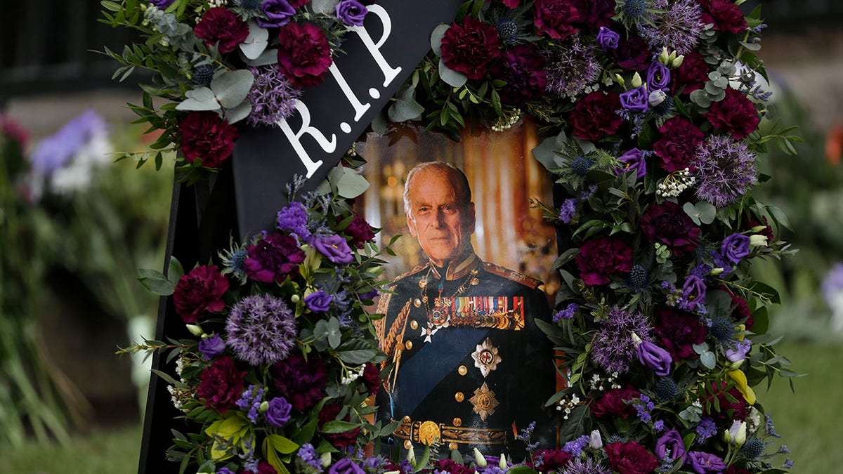 A floral tribute design to Prince Philip, which doesn't contain any floral foam, to be good for the environment and minimize plastic waste, by floral designer Lisa Darban is displayed to be photographed before being removed to be placed in an officially sanctioned location elsewhere in the town, in front of tributes outside Windsor Castle.