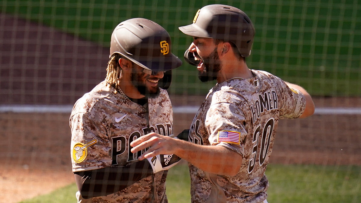 Eric Hosmer celebrating with Fernando Tatis