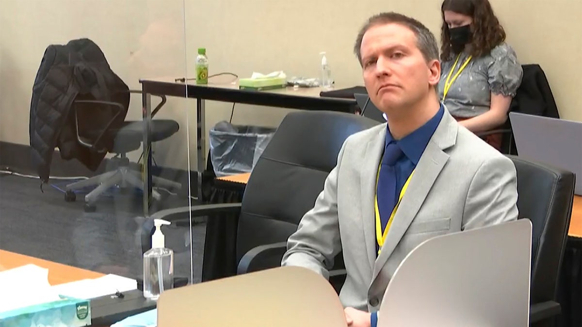 In this image from video, former Minneapolis police Officer Derek Chauvin listens as his defense attorney Eric Nelson gives closing arguments as Hennepin County Judge Peter Cahill preside Monday, April 19, 2021. (Court TV via AP, Pool)