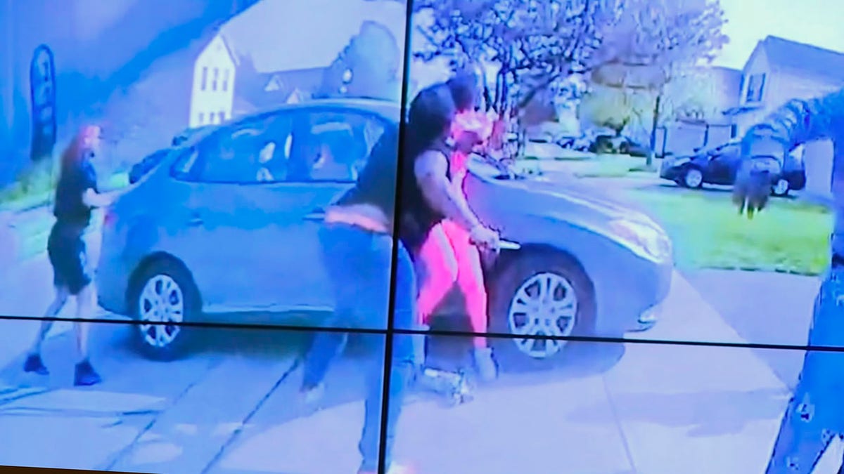 In an image from police bodycam video that the Columbus Police Department played during a news conference Tuesday night, April 20, 2021, a teenage girl, foreground, appears to wield a knife during an altercation before being shot by a police officer Tuesday, April 20, 2021, in Columbus, Ohio. (Columbus Police Department via WSYX-TV via AP)