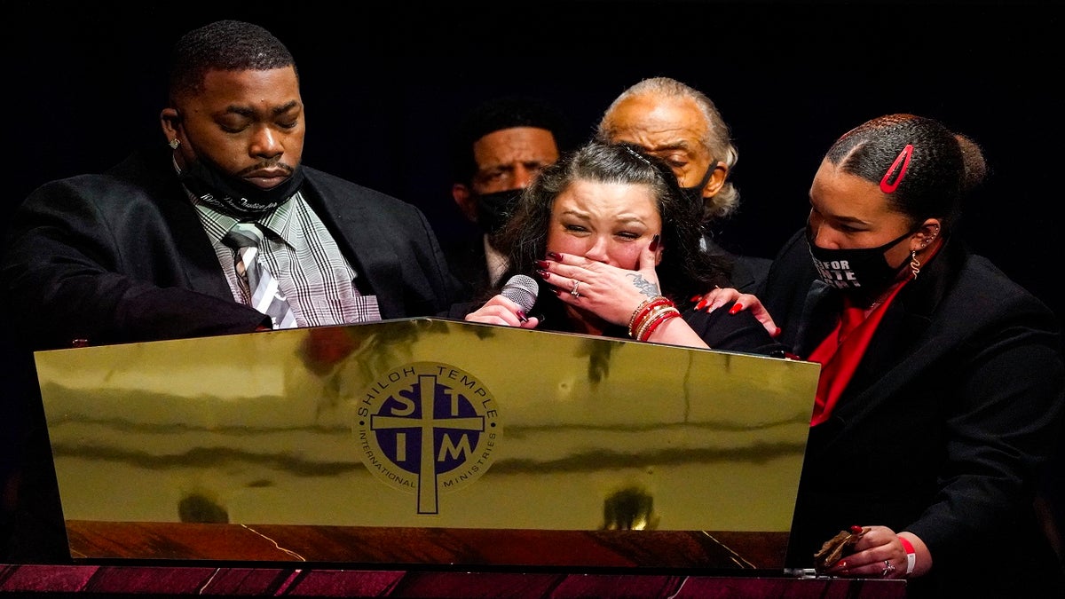 Katie and Aubrey Wright, parents of Daunte Wright, cry as the speak during funeral services of Daunte Wright at Shiloh Temple International Ministries in Minneapolis, Thursday, April 22, 2021. Wright, 20, was fatally shot by a Brooklyn Center, Minn., police officer during a traffic stop. (AP Photo/Julio Cortez, Pool)