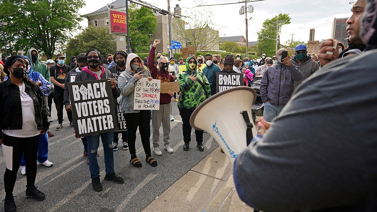 People gather for a peaceful demonstration, Thursday, April 22, 2021, in Elizabeth City, N.C., protesting the shooting of Andrew Brown Jr., 42, by a deputy sheriff trying to serve a search warrant. (AP Photo/Gerry Broome)