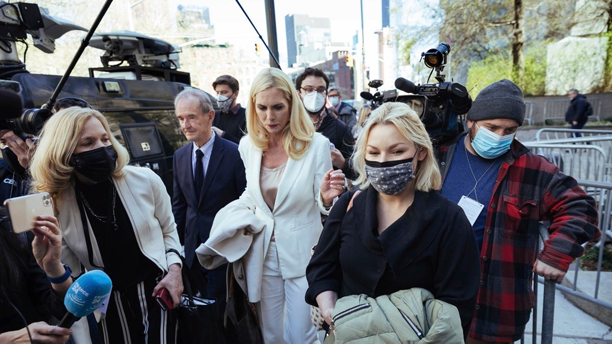 Accuser Danielle Bensky, at right, departs following Ghislaine Maxwell's appearance in Federal Court on Friday in New York. (AP Photo/Kevin Hagen)